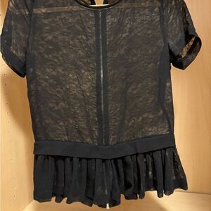 Sheer black peplum